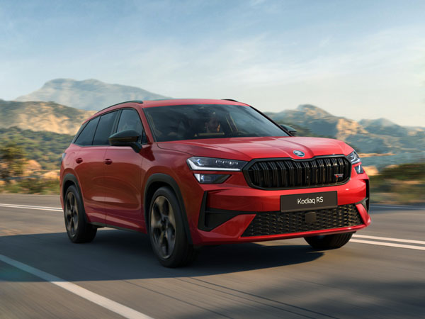 A red sports SUV driving