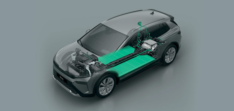 A green SUV on a dark green soundstage