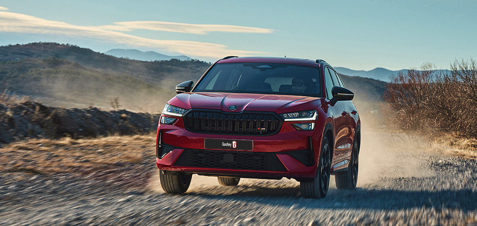 A red Sports SUV driving on a dirt road