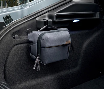 A bag hanging on the Skoda boot hooks
