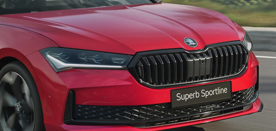 Front headlights and design of a Red Skoda Superb